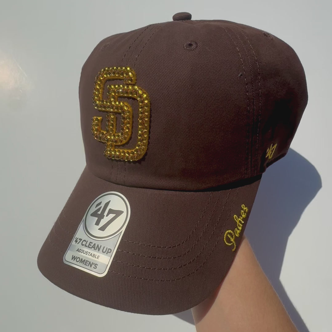 Product video of Rhinestoned San Diego Padres Clean Up Hat in Brown displaying rhinestones sparkling in the sunlight 