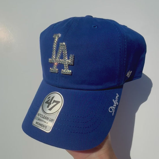 Product video of Rhinestoned Los Angeles Dodgers Clean Up Dad Hat in color royal blue displaying rhinestones sparkling in the sunlight